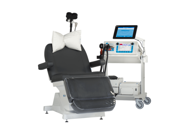 A TMS Therapy Machine showing a comfortable chair and electronic TMS system
